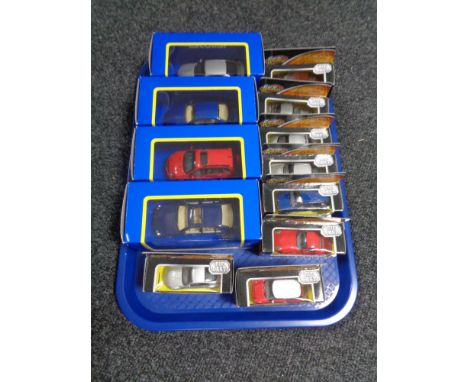 A tray of thirteen boxed Corgi die cast vehicles 
