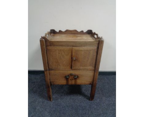 A George III mahogany double door commode cabinet on raised legs 