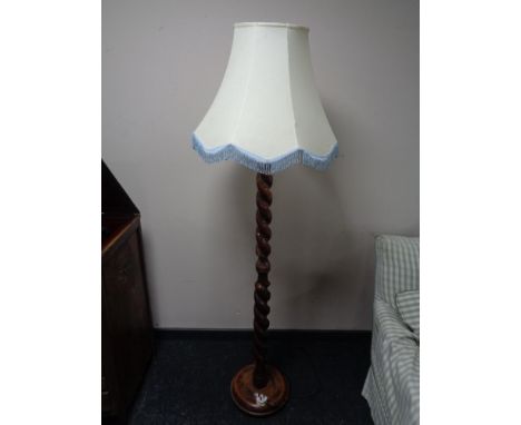 An early twentieth century barley twist standard lamp with shade 