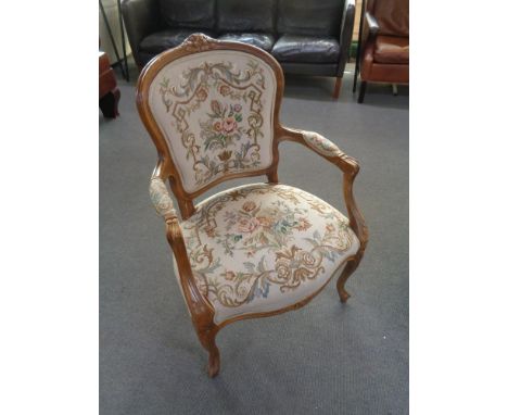 A continental beech framed armchair in tapestry fabric 