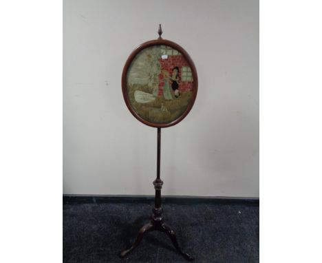 A Victorian tapestry pole screen 