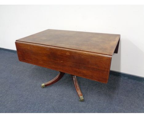 A Victorian mahogany pedestal pembroke table 