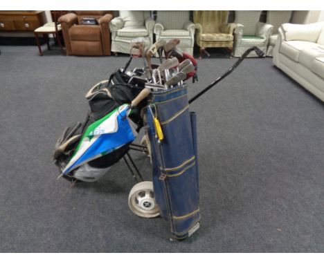 A Pogen golf bag containing Dunlop irons and drivers, folding gold trolley and a further golf bag of irons and wooden headed 