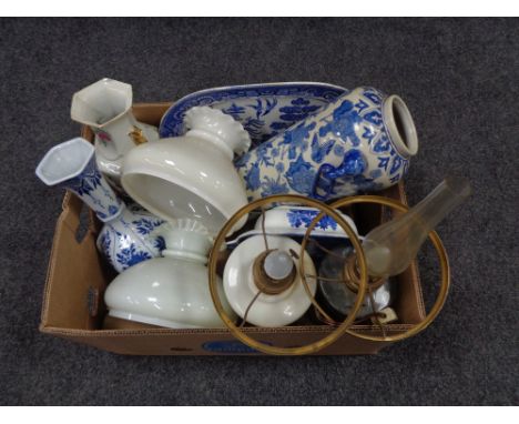 An antique converted oil lamp, blue and white pattern meat plate, blue and white vases etc 