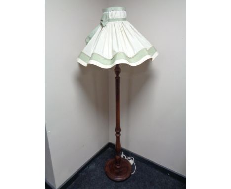 A 20th century stained beech standard lamp and shade 