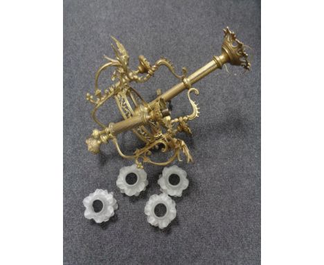 A continental brass chandelier with glass shades