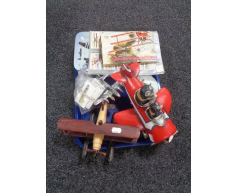 A tray of Bradford Exchange aircraft collector's plates, cigarette cards, pin badges, etc 