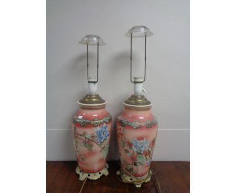 A pair of early 20th century Chinese floral pattern vases converted to table lamps on brass bases 