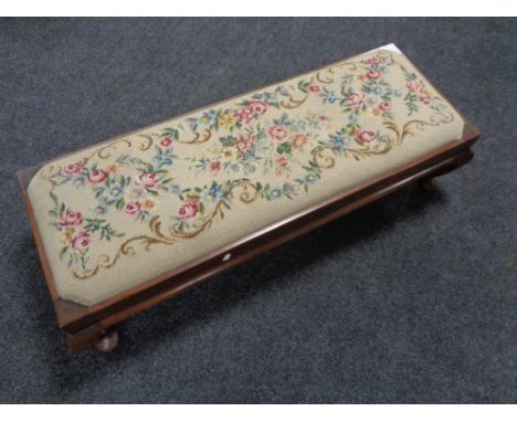 An Edwardian mahogany tapestry duet footstool 