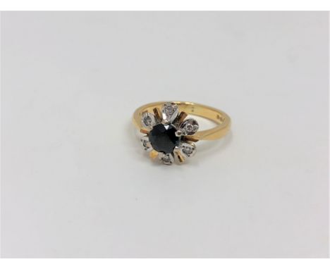 An 18ct gold sapphire and diamond cluster ring, size K CONDITION REPORT: 3.9g