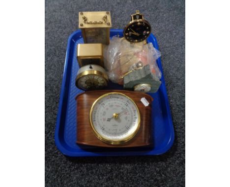 A tray of assorted 20th century barometer, assorted carriage and desk clocks. 