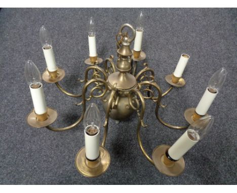 A continental brass eight branch chandelier 