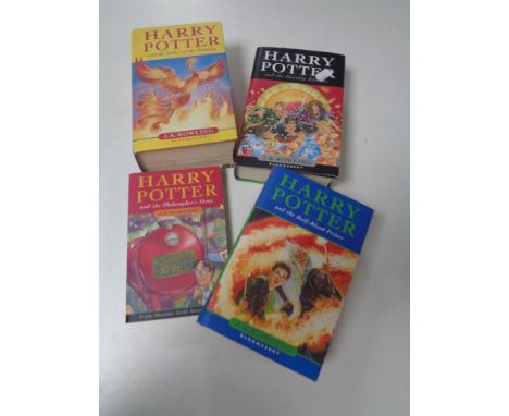 Four Harry Potter books, one bearing J K Rowling signature and three marked First Editions. (4)