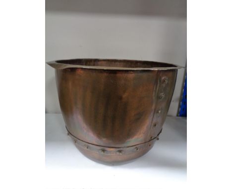 An antique copper planter 