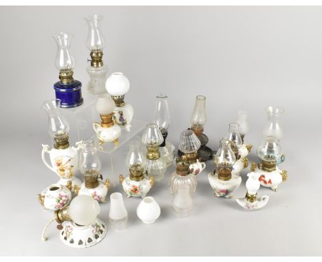 A Collection of Various Ceramic and Glass Oil Lamps