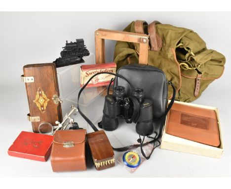 A Collection of Various Items to Comprise Canvas Rucksack, Binoculars, Compass, Tie Press etc