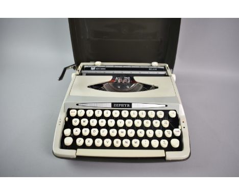 A Vintage Manual Portable Typewriter by Silver Reed, "The Silverette"