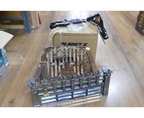 Cast metal fire grate and box of heavy duty chain locks with keys 