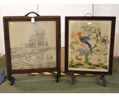 Two tapestry firescreens, one featuring castle ruins and cattle grazing  