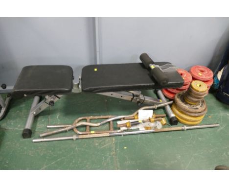 Weights bench, barbells and three weight plates 