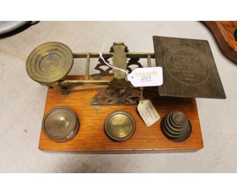 Balance postal scales with weights