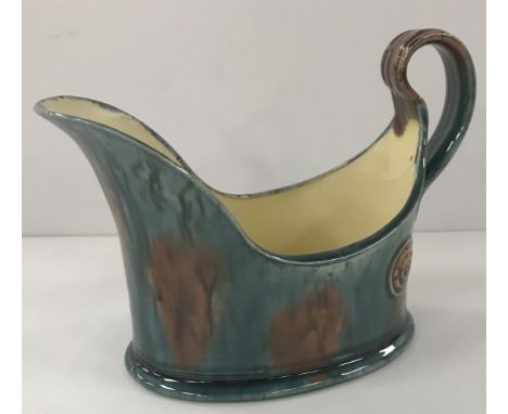 A Wally Keeler blue brown glazed sauceboat with loop handle, 18.5 cm long x 12 cm high CONDITION REPORTS There is some crazin