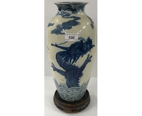 A Mintons Art Pottery Studio Kensington Gore chinoiserie dragon and stork decorated blue and white vase numbered to base "297