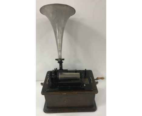 An oak cased Edison Phonograph together with metal horn and seven discs including "It blew blew blew", "Just a wee deoch", "O