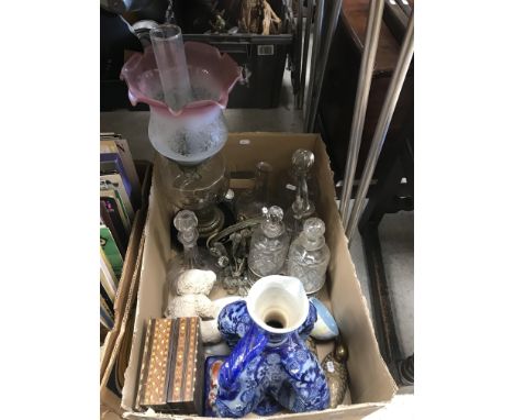 A box containing an early 20th Century oil lamp with cranberry and clear glass shade, a Mettlach style puzzle type jug, vario