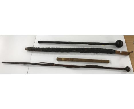 A 19th Century copper wire embellished Zulu knobkerrie, 75.5 cm high, a similar walking stick with entwined snake decoration,