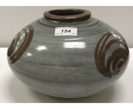 A David Leach Lowerdown Pottery of Bovey Tracy Pottery vase with spiral decoration on a blue ground, circa 1956, bears impres