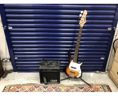 A Peavey Milestone 3 electric bass guitar and stand, together with a Crate BX-15 amp / speaker