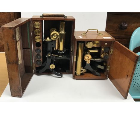 A Negretti & Zambra of London anodised steel and lacquered brass cased microscope, approx 18.5 cm high, together with various