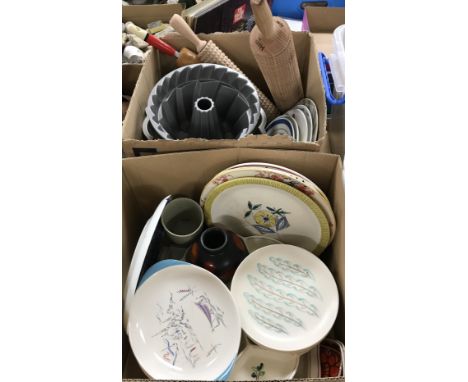 A box containing three modern Bundt tins, a Norwegian hegg cracker roller, another similar textured rolling pin and a typical