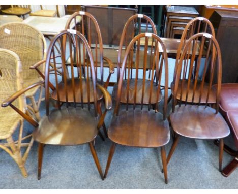 A set of two carving and four single Ercol stick back dining chairs