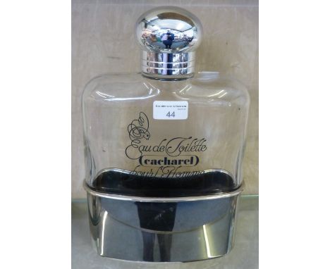 A French 1980's Cacharel eau de toilette bottle in the shape of a hip flask, 30cm tall