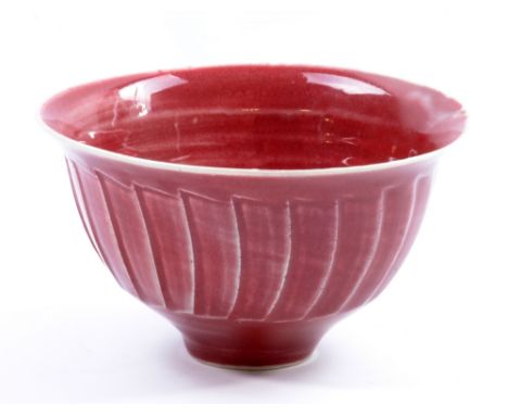 DAVID LEACH (1911-2005) for Lowerdown Pottery; a fluted porcelain bowl covered in copper red glaze, impressed DL mark, diamet