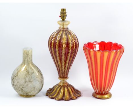 A Venetian ruby glass and gold flecked lamp base, height including fitment 46cm, a similar vase, height 27cm, and a gold flec