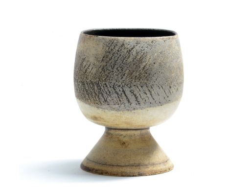 HANS COPER (1920-1981); a stoneware cup form with cylindrical flower holder on splayed base, white slip over textured mangane