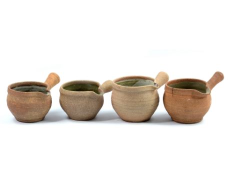 Leach Pottery; four stoneware sauce boats, impressed pottery marks, tallest height 8cm (4). CONDITION REPORT: Firing crack to