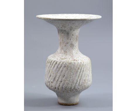 LUCIE RIE (1902-1995); a fluted stoneware bottle with flared rim covered in mottled white glaze, impressed LR mark, height 18