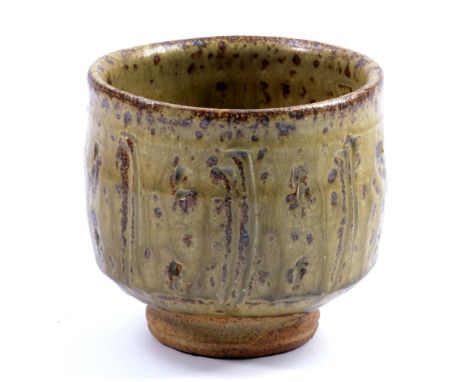 JIM MALONE (born 1946); a stoneware yunomi covered in green ash glaze, impressed JM mark, height 9cm. (D)   CONDITION REPORT: