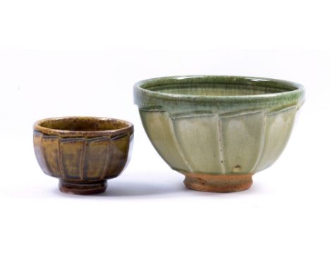 RICHARD BATTERHAM (born 1936); a cut-sided stoneware footed bowl covered in green ash glaze, diameter 22.5cm, and another sma