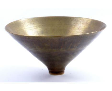 SUTTON TAYLOR (born 1943); an earthenware flared bowl covered in brushed silver and gold glaze, impressed ST mark, diameter 2