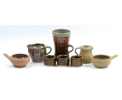 Leach Pottery; three stoneware egg cups, two ramekins, two jugs and a mug, impressed pottery marks, tallest height 13.5cm (8)