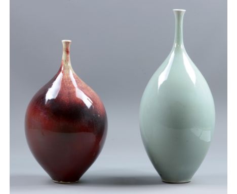 ALEX SHIMWELL (born 1980); two porcelain teardrop bottles, celadon and copper red glazes, impressed S marks, tallest height 3
