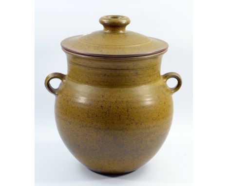 DAVID LLOYD JONES (1928-1994); a large stoneware bread crock with lug handles covered in mottled olive green glaze, impressed