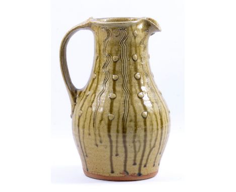 JIM MALONE (born 1946); a stoneware jug with applied decoration covered in running green ash glaze, impressed JM and A for Ai