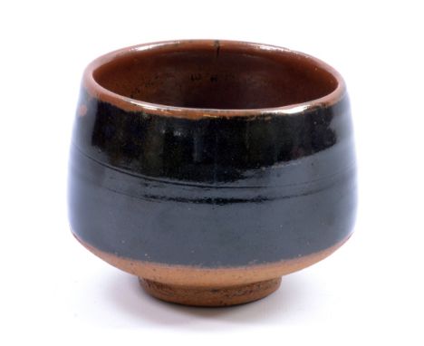 BERNARD LEACH (1887-1979) for Leach Pottery; a stoneware yunomi covered in tenmoku and kaki glaze, impressed BL and pottery m