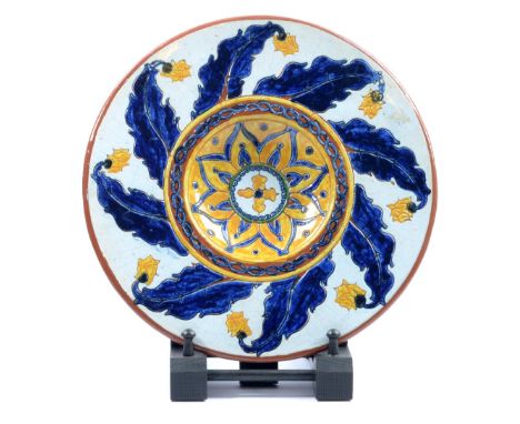 CARLO MANZONI; an earthenware dish with incised floral decoration, incised marks, hand drawn and painted 'CM 1898 N.46, PCA',